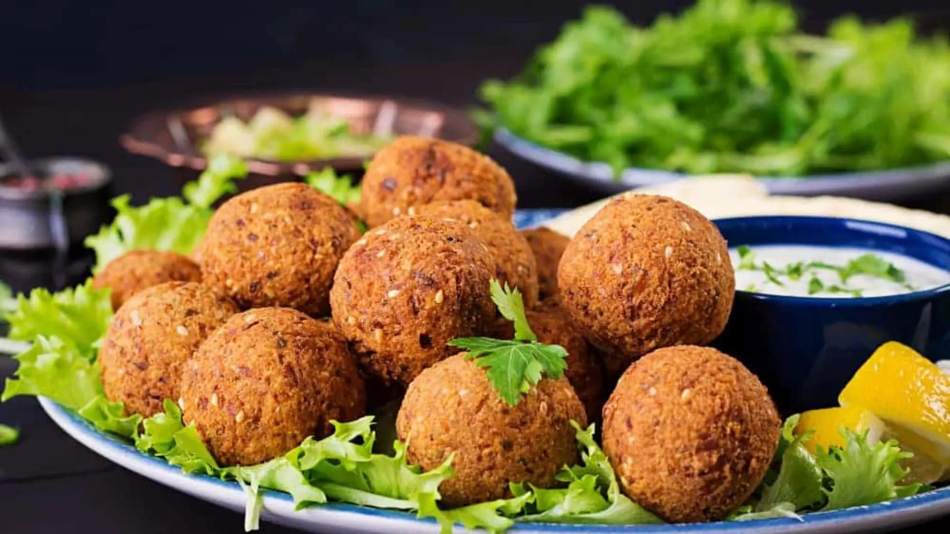 Crisp falafel on a bed of lettuce with lemon
